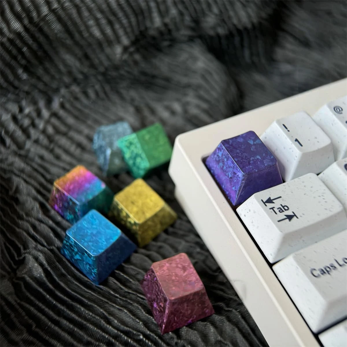 Mixed-size ice-crystal titanium keycaps