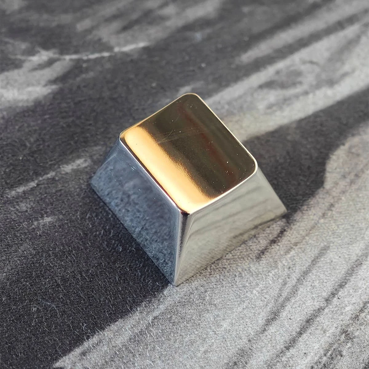 Polished titanium keycap